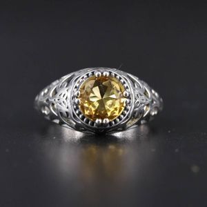 Silver Ring with Yellow Gemstone